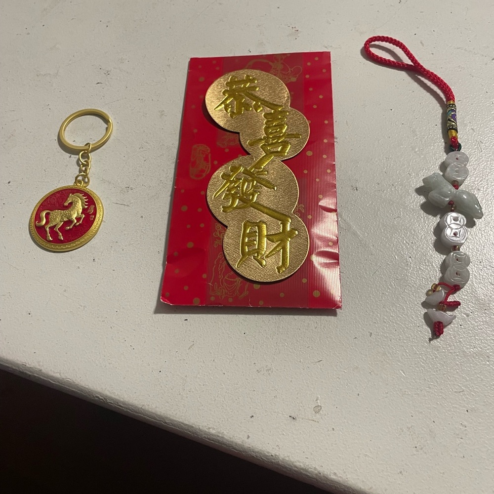 Red and Gold Keychain with Horse Design